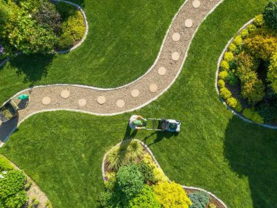 big-garden-grass-field-mowing-by-caucasian-gardener.jpg